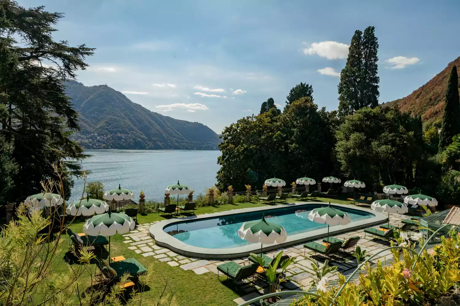 A beautifully manicured pool area overlooking Lake Como at the Passalacqua hotel.