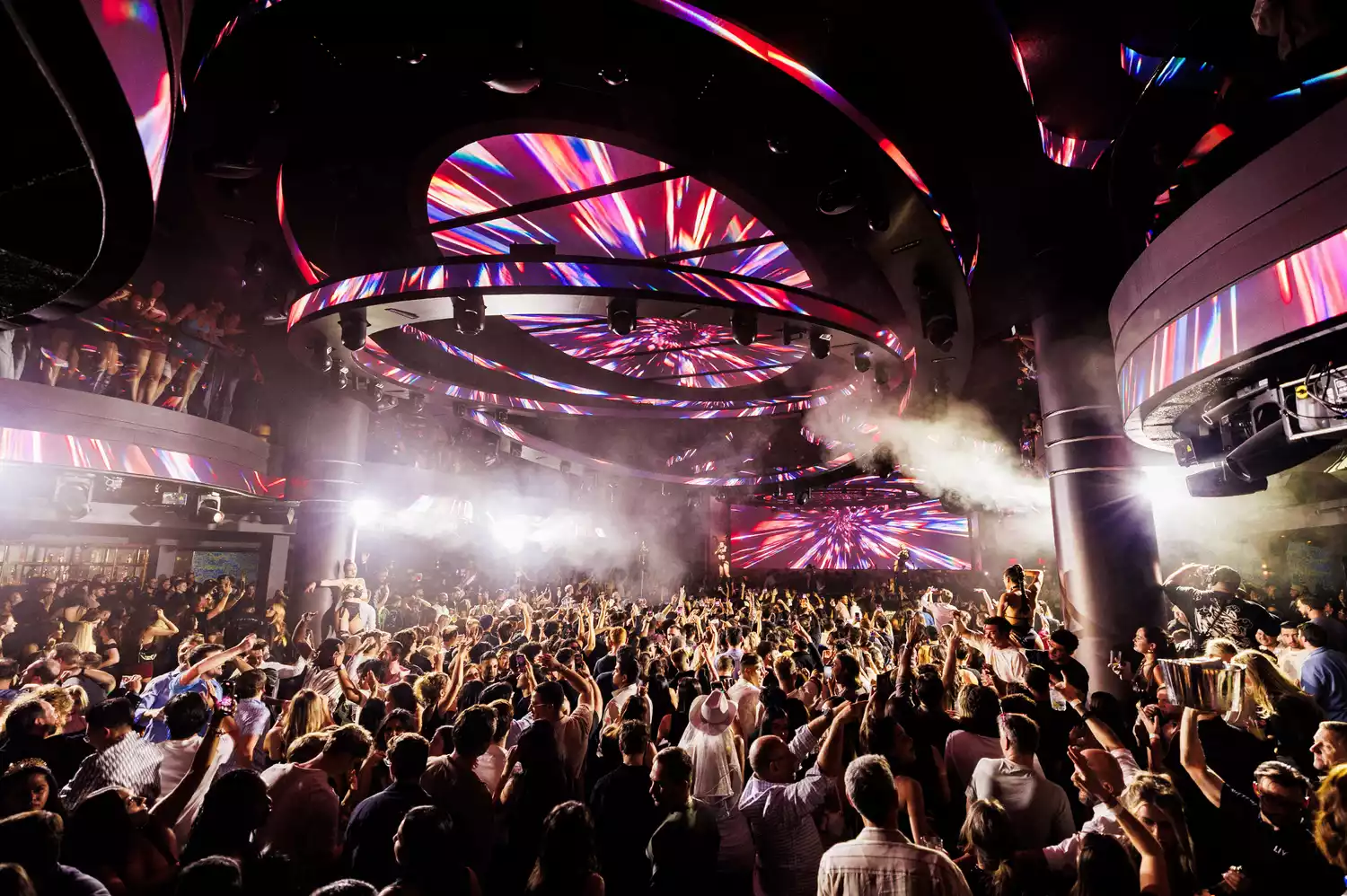 DJ David Guetta performing at the lowered stage of LIV Nightclub surrounded by immersive LED screens.