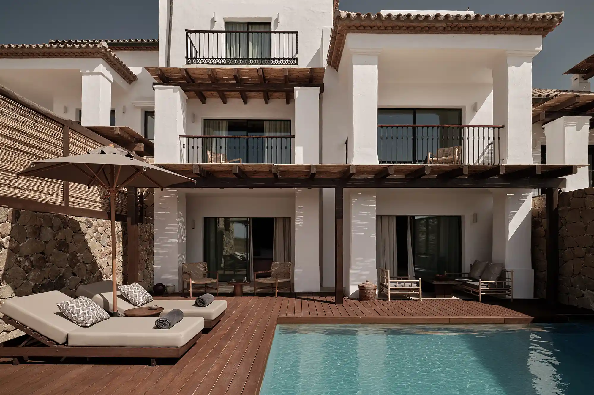 A luxury villa suite at Oku Andalusia with a private infinity plunge pool and sun loungers.