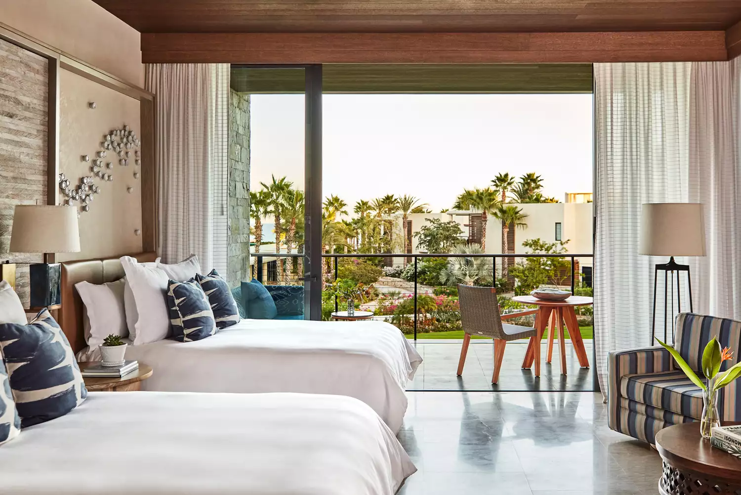 Modern guest room interior at Chileno Bay Resort with clean lines and neutral tones.