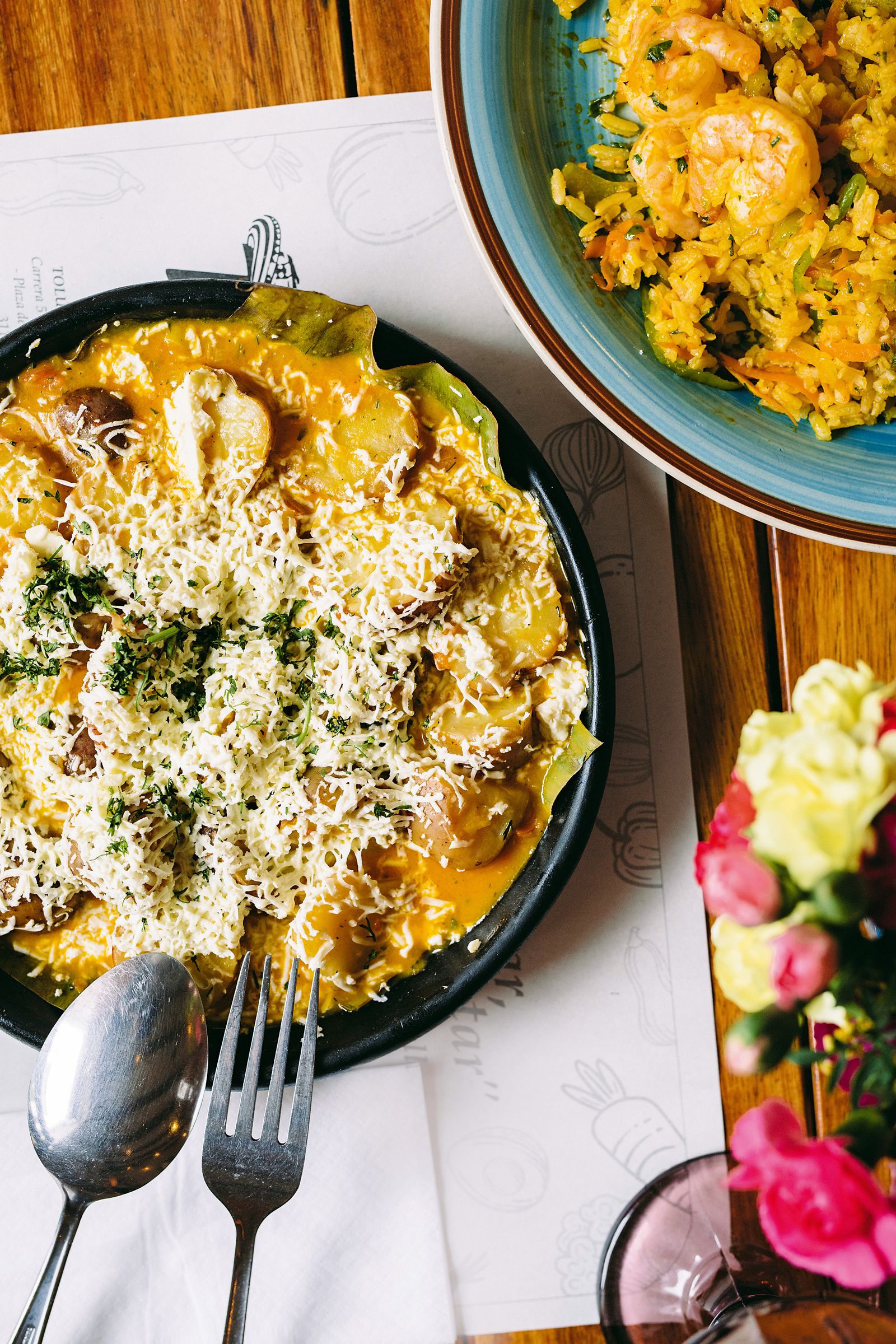 Detailed food presentation of a dish using exotic Amazonian flora and unique Colombian textures.