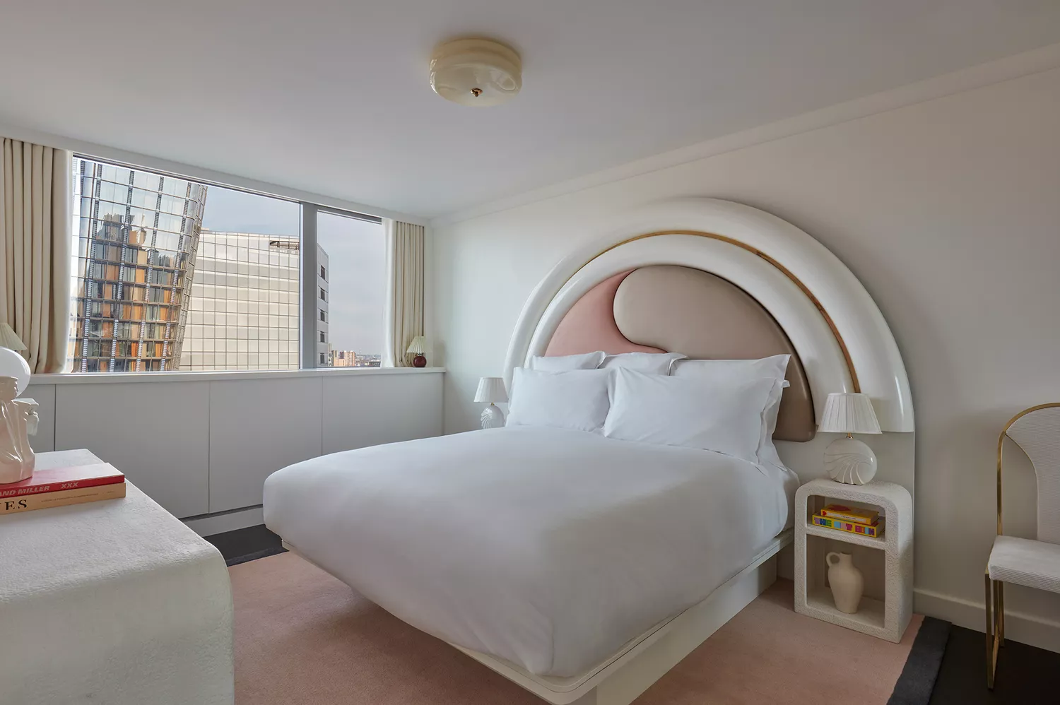 A luxurious bedroom within the Dynasty Cabin Suite showing 1980s-inspired design elements.