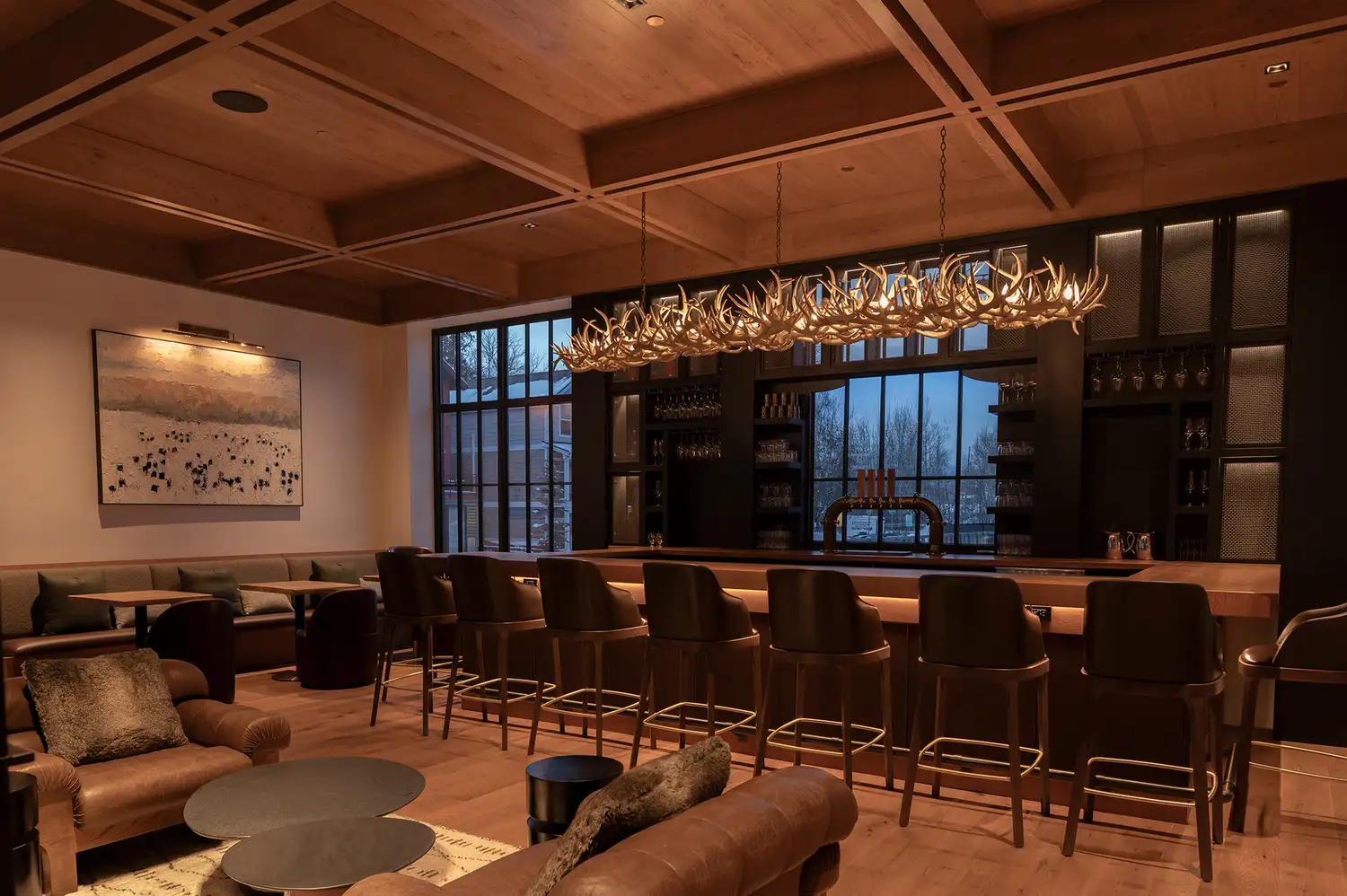 Interior of the bar at Enga restaurant with wooden accents and modern lighting.