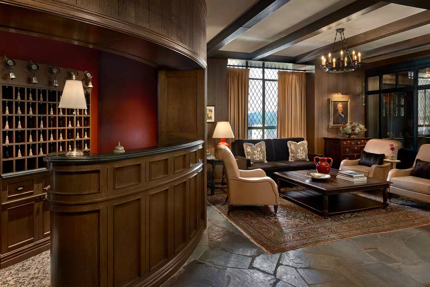 The refined lobby and check-in area of the Deer Path Inn with traditional English manor styling.