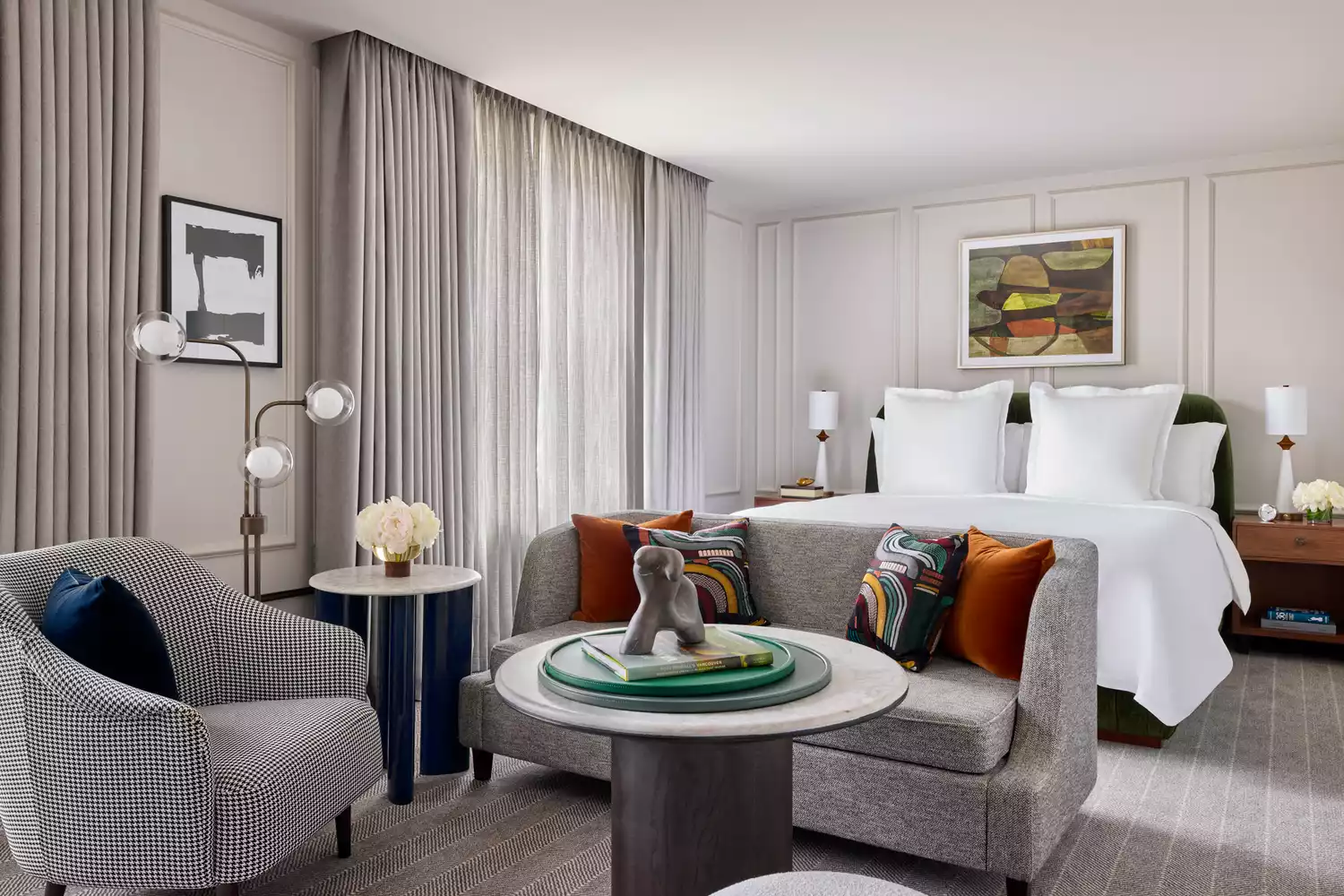 Sophisticated guest room at the Rosewood Hotel Georgia with muted tones and classic furniture.