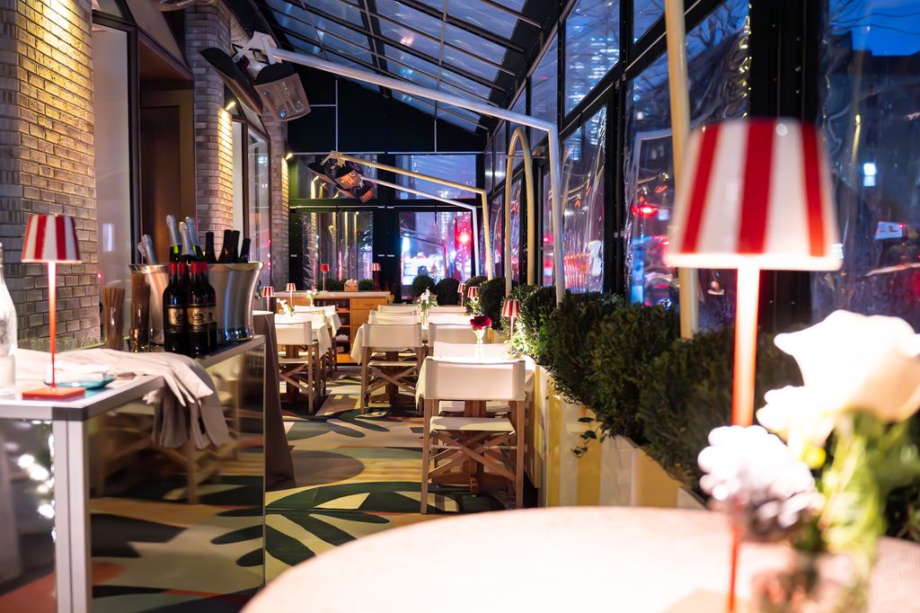 The heated and covered terrace at Cucina Alba with vibrant Italian-inspired decor.