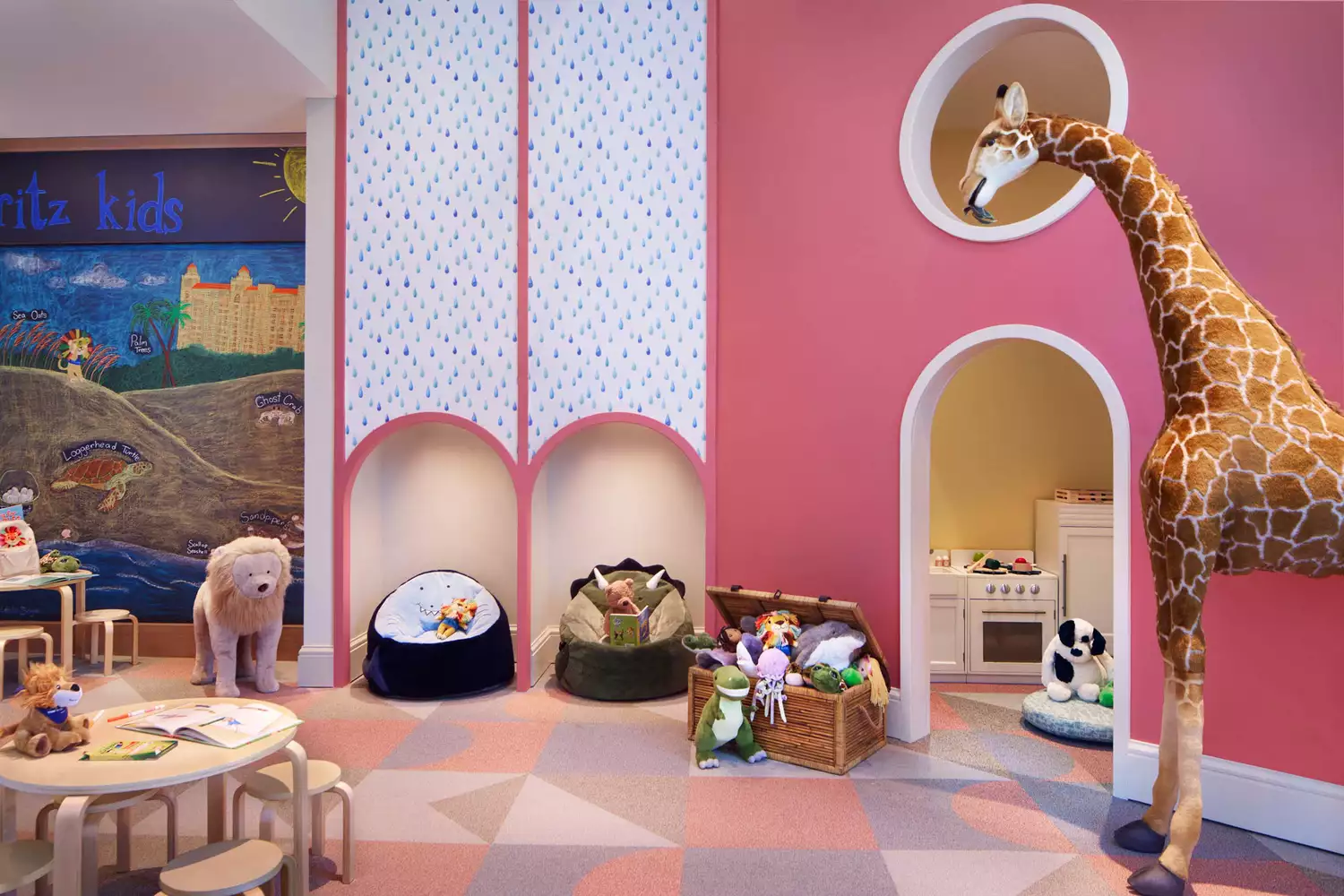 A bright and interactive kids' lounge area featuring colorful furniture and creative play zones.