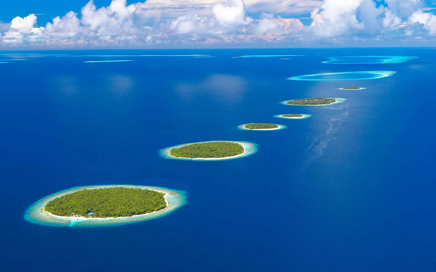 Aerial view of the Maldives Islands in the Indian Ocean showing turquoise waters.