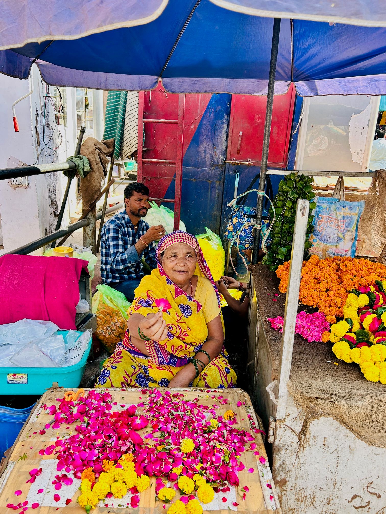 A vibrant and crowded Indian marketplace scene showing local culture and people.