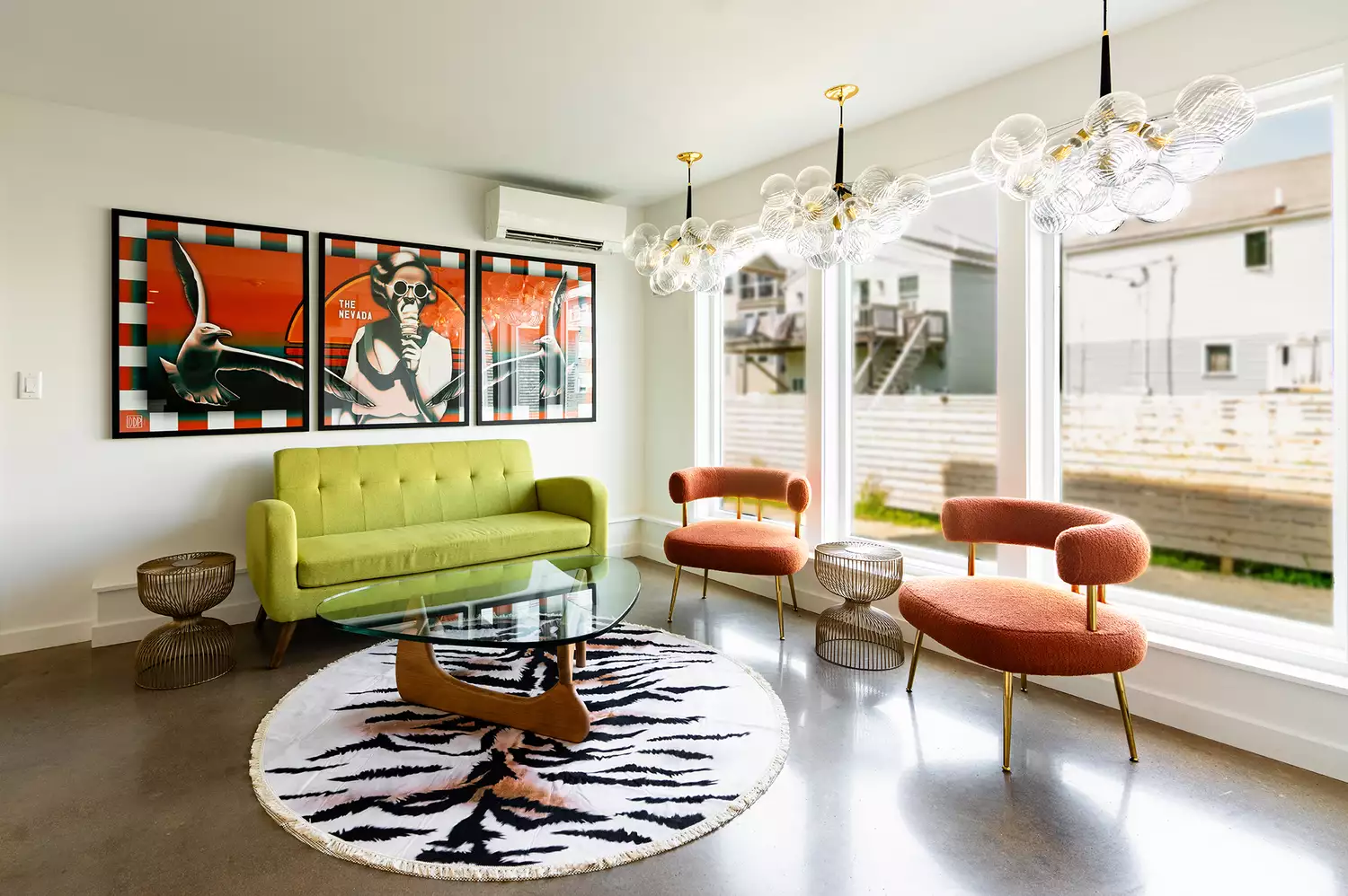The vibrant and colorful lobby of The Nevada Hotel featuring mid-century modern furniture and decor.