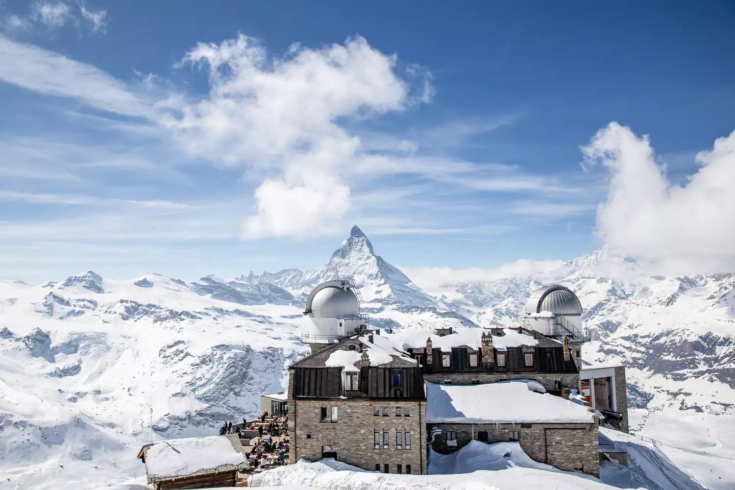Snow-covered peaks and village rooftops in Zermatt.