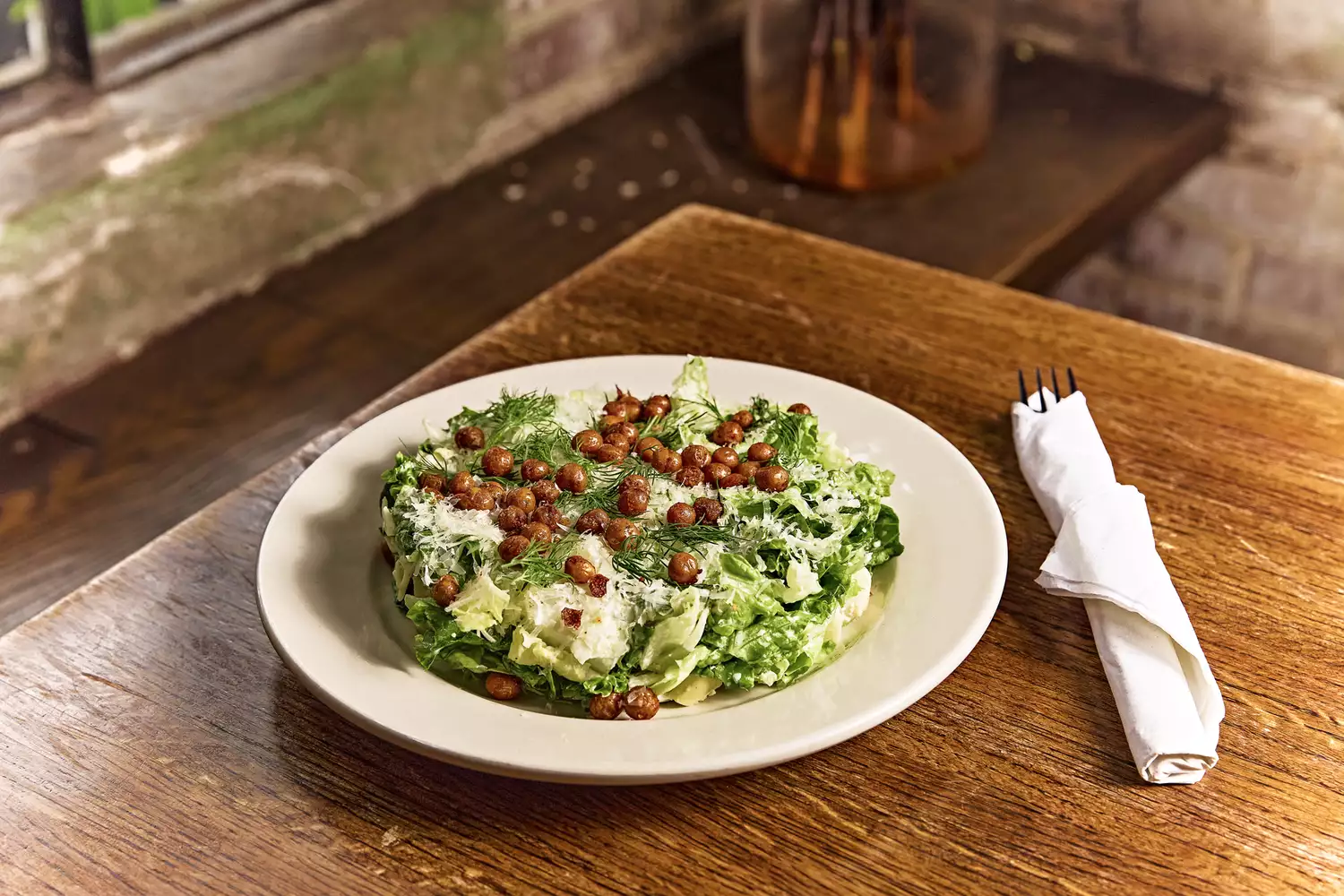 A Caesar salad with crispy chickpeas served at Brasil in the Montrose neighborhood.