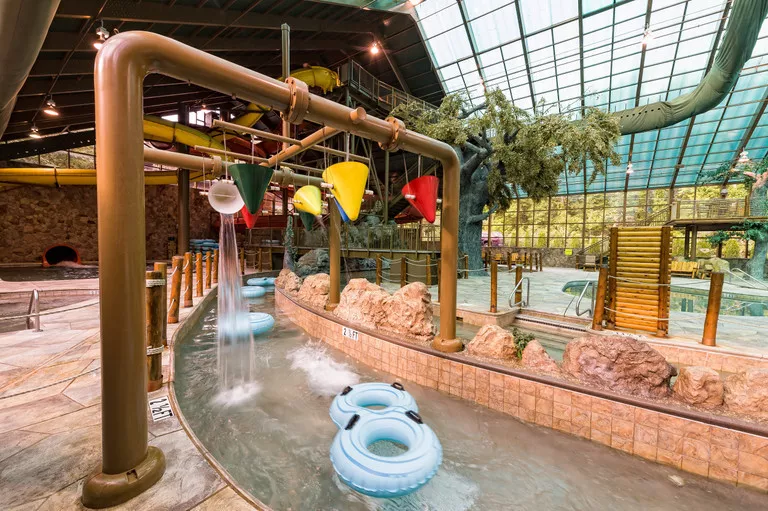 Large indoor water park facility with slides and pool areas.