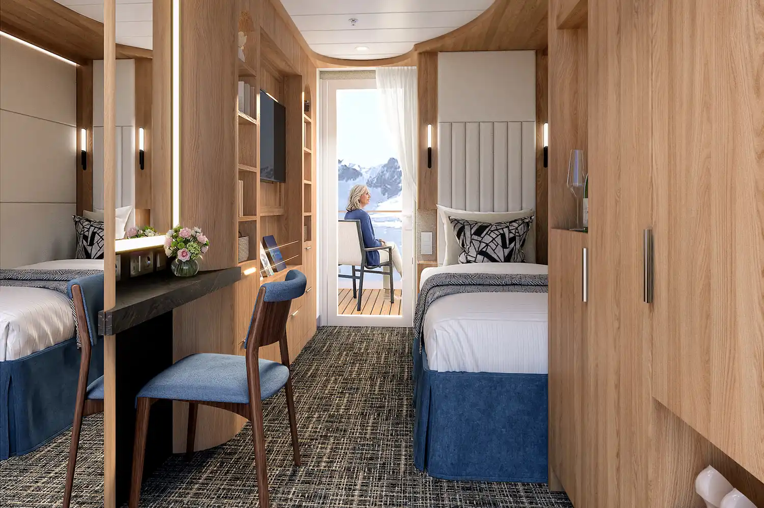 Interior view of a modern Holland America solo cabin with a private balcony and integrated workspace.