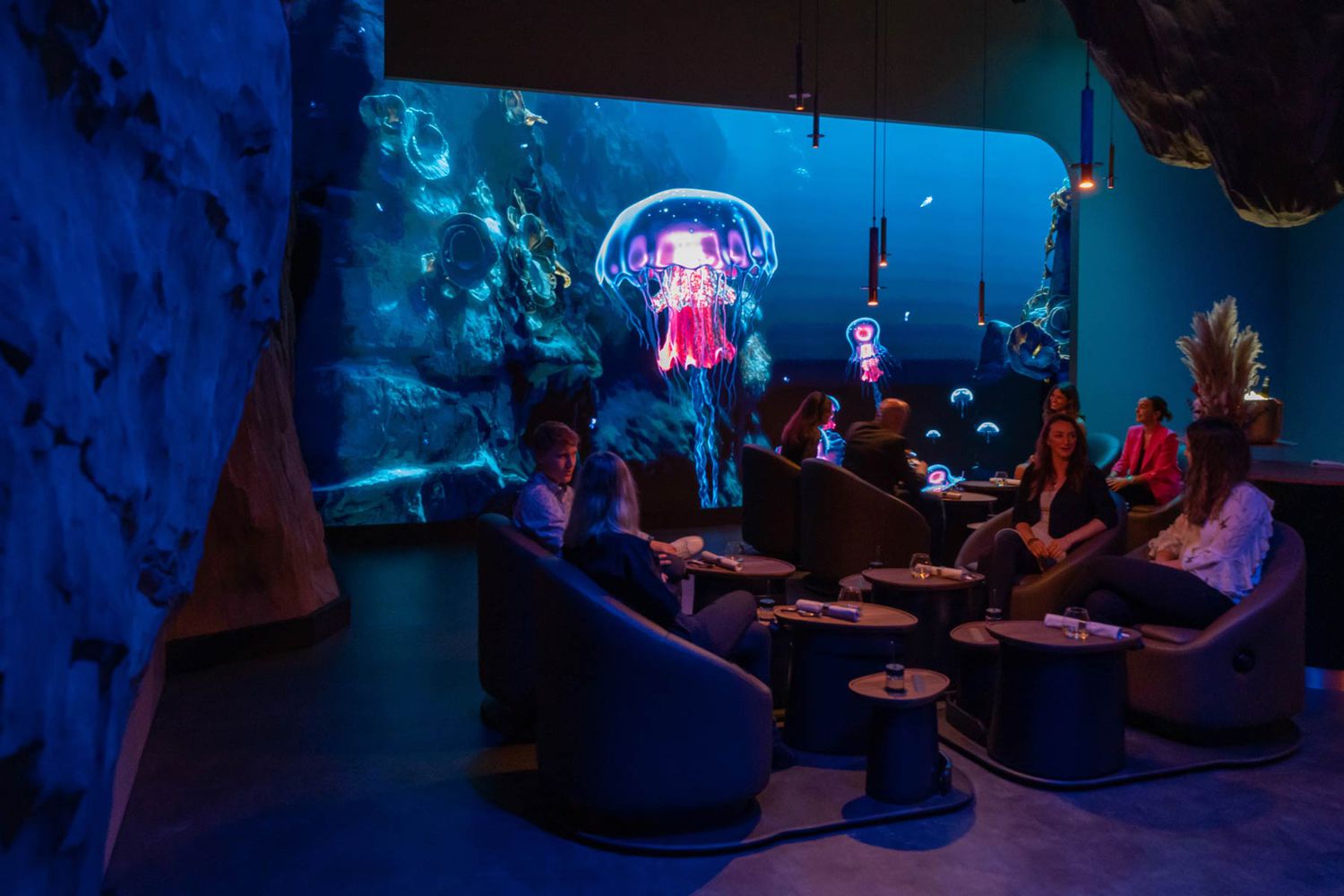 A high-contrast featured image showcasing the futuristic interior design of the Eatrenalin experience.