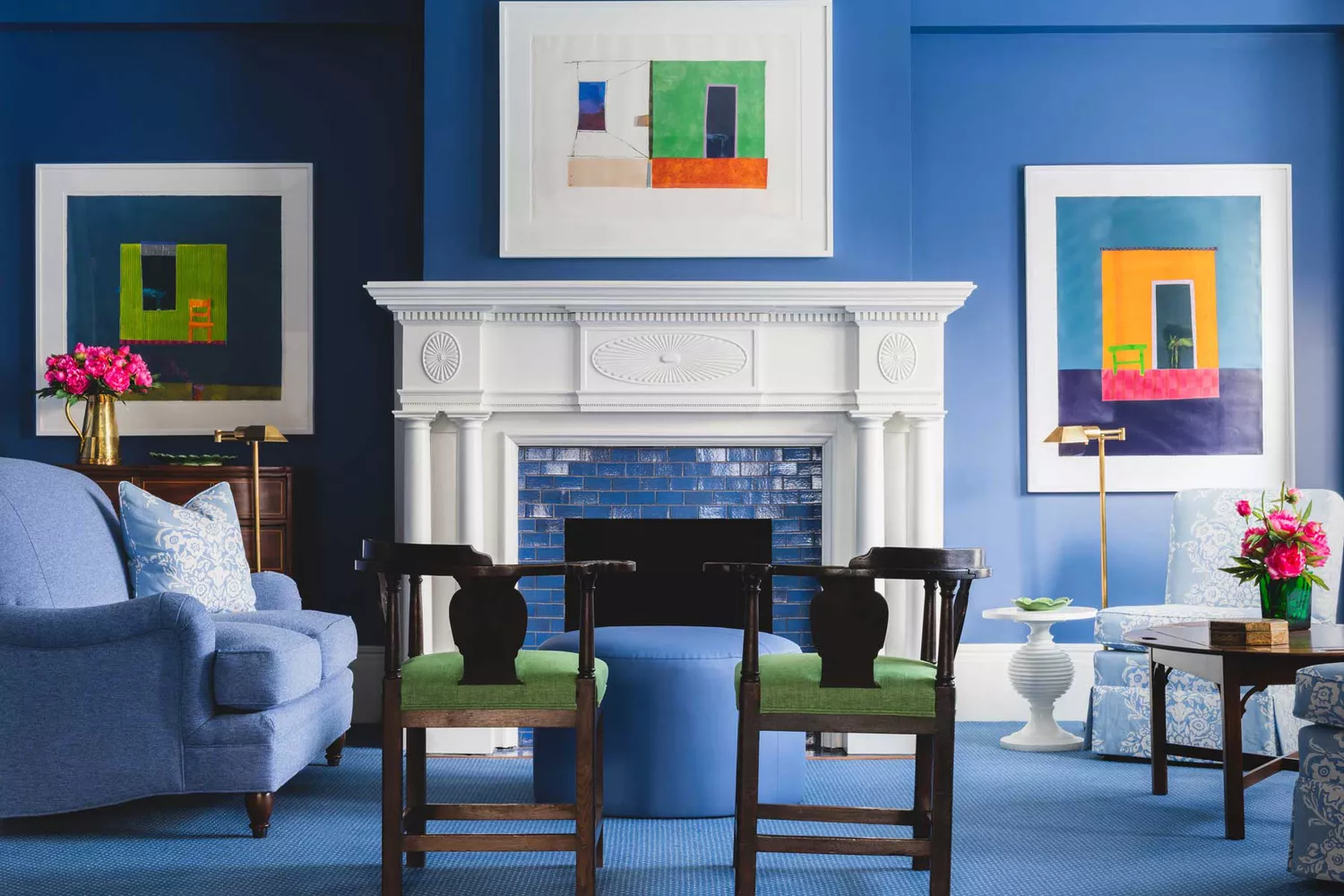 The interior of the blue lounge at Inns of Aurora featuring sophisticated blue walls and elegant furniture.