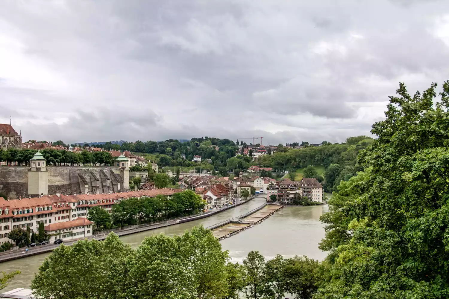 Historic buildings along the Aare River in the Old Town of Bern.
