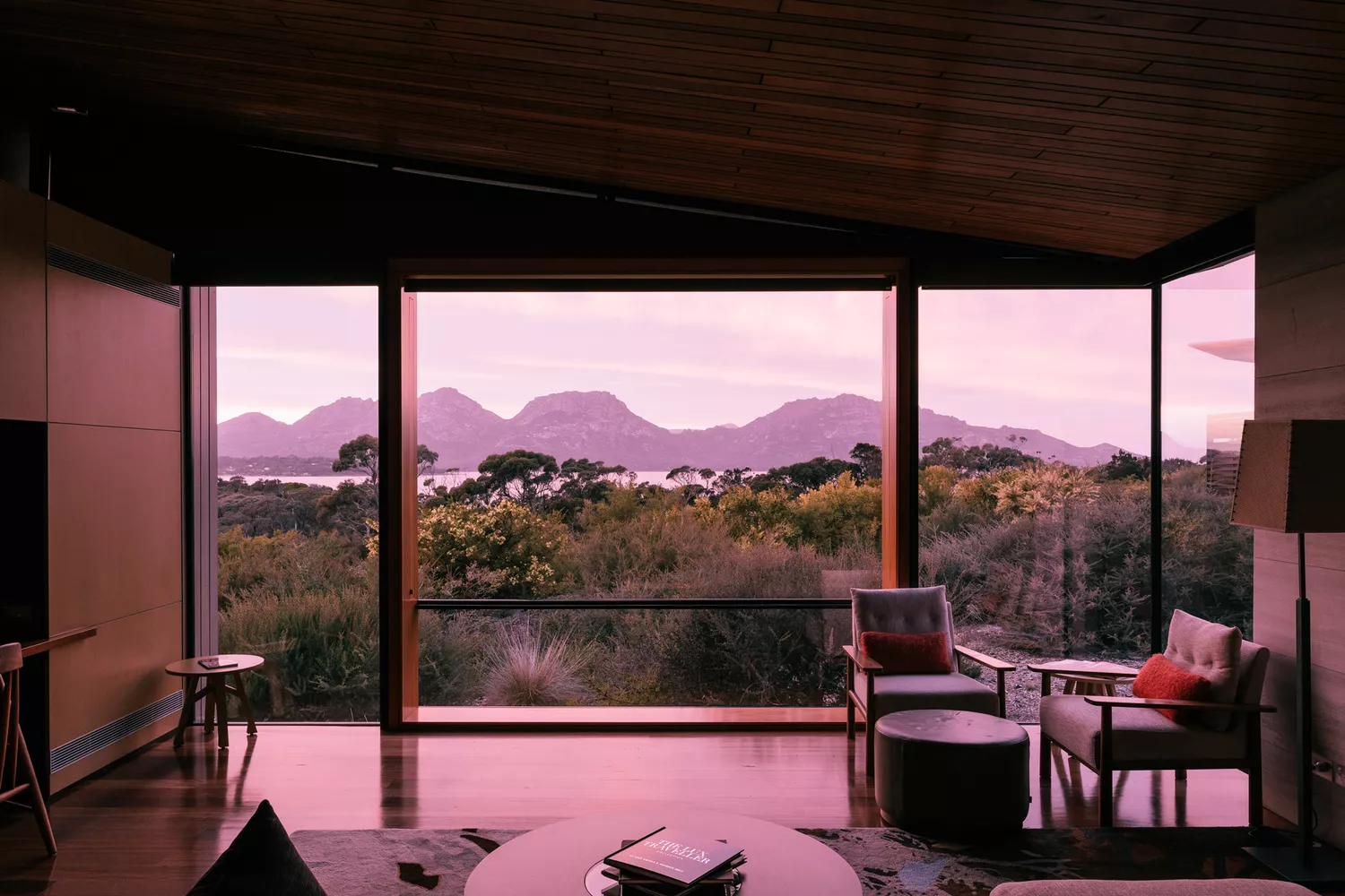 A luxury suite at Saffire Freycinet featuring expansive views of the Tasmanian wilderness.