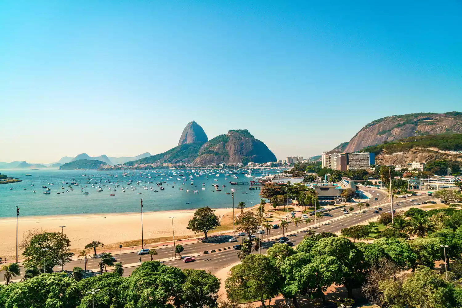 Sunset view of Sugarloaf Mountain and the harbor in Rio de Janeiro, Brazil.