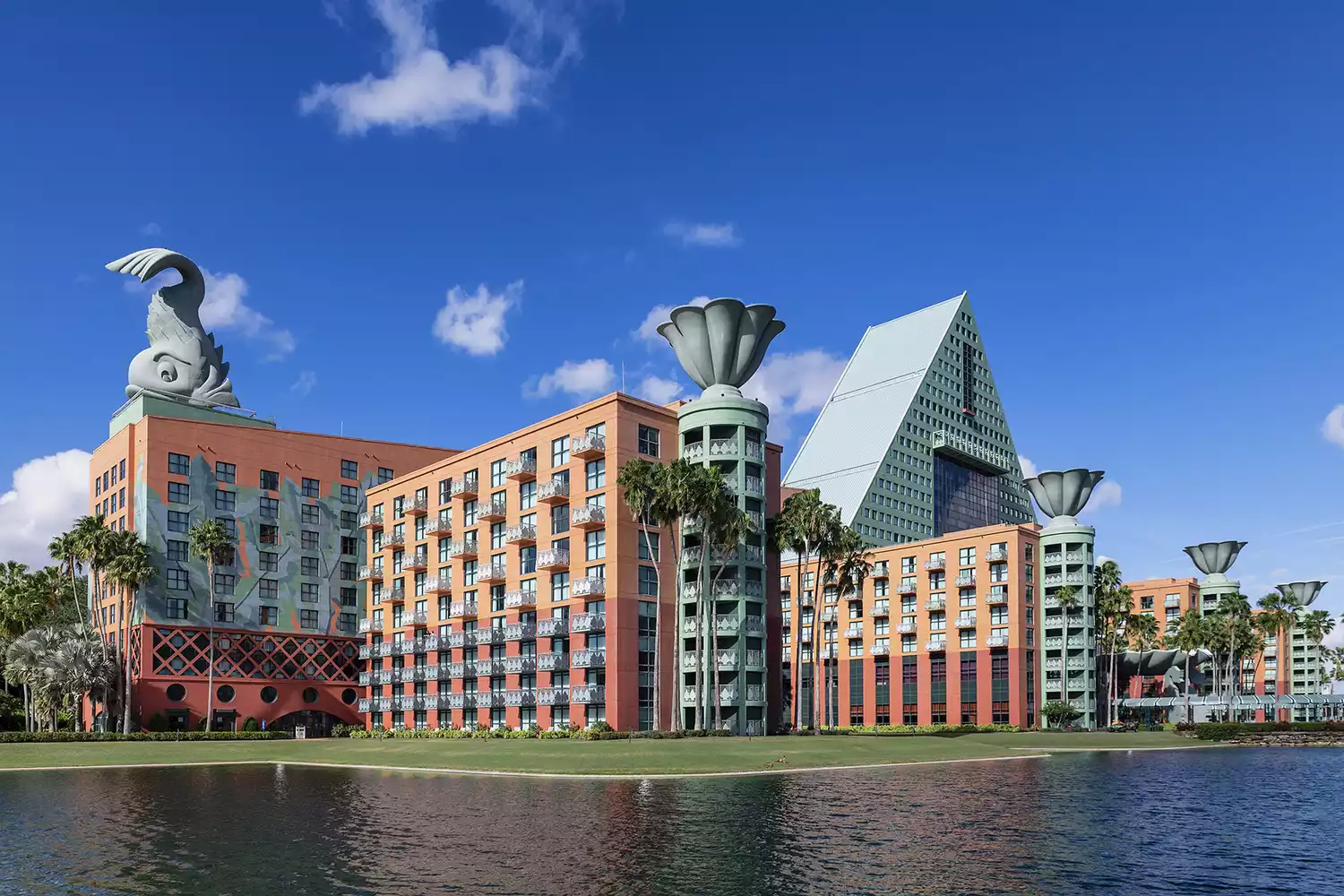 The exterior of the Disney World Dolphin Resort under a clear sky.