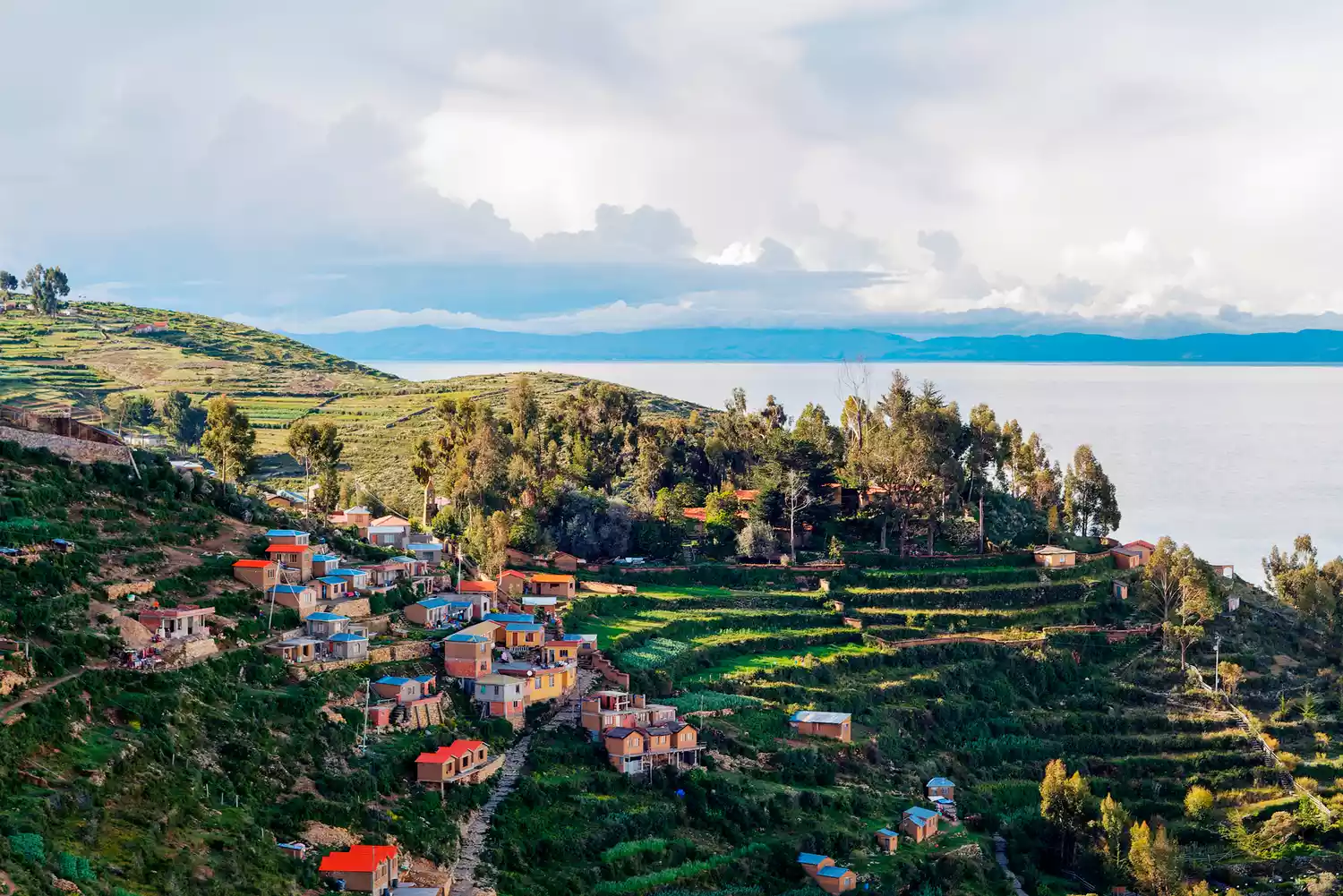 The hillside village of Yumani on Isla del Sol featuring traditional stone terraces overlooking the lake.