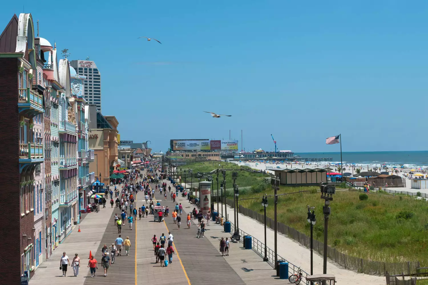 An elevated perspective showing the long stretch of the Atlantic City boardwalk against the coastline.