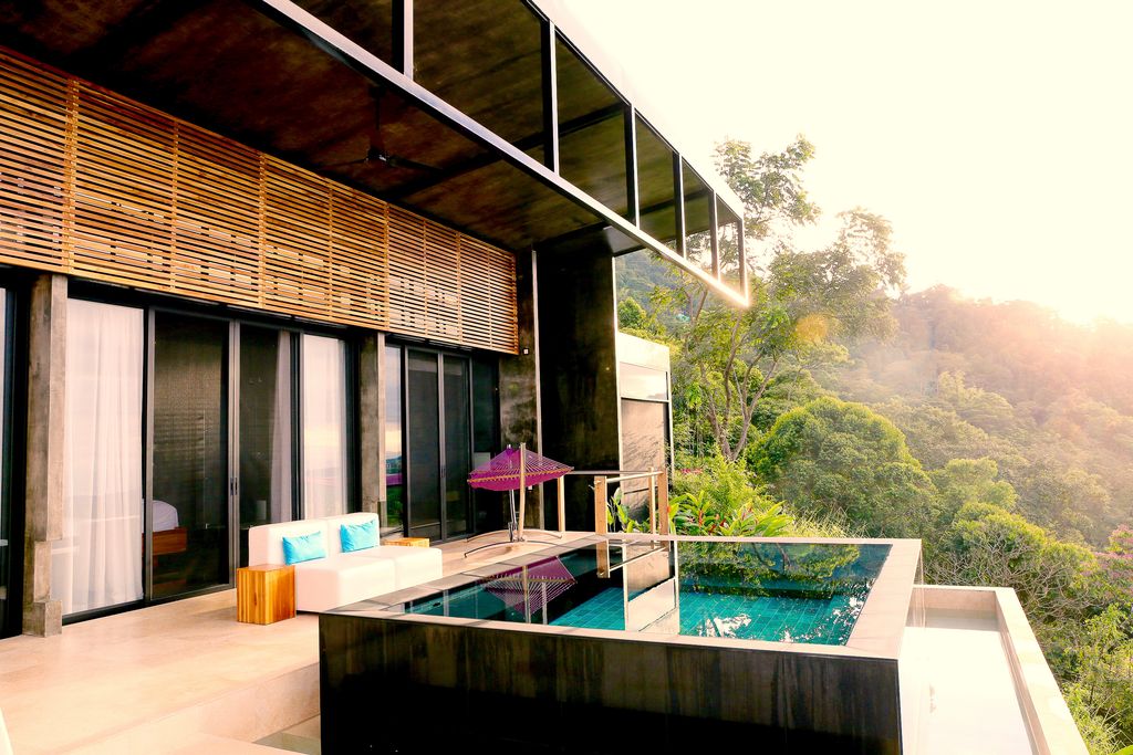 Luxury infinity pool at Kura Boutique Hotel overlooking the tropical rainforest and Pacific coast.
