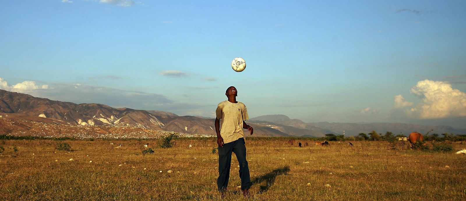 Close-up portrait of a professional footballer with a focus on match concentration.