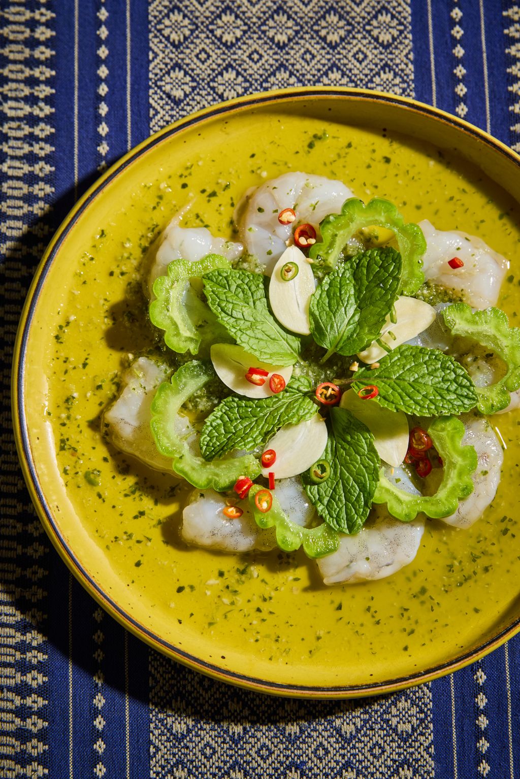 A variety of colorful Thai seafood dishes on a table at Fish Cheeks.