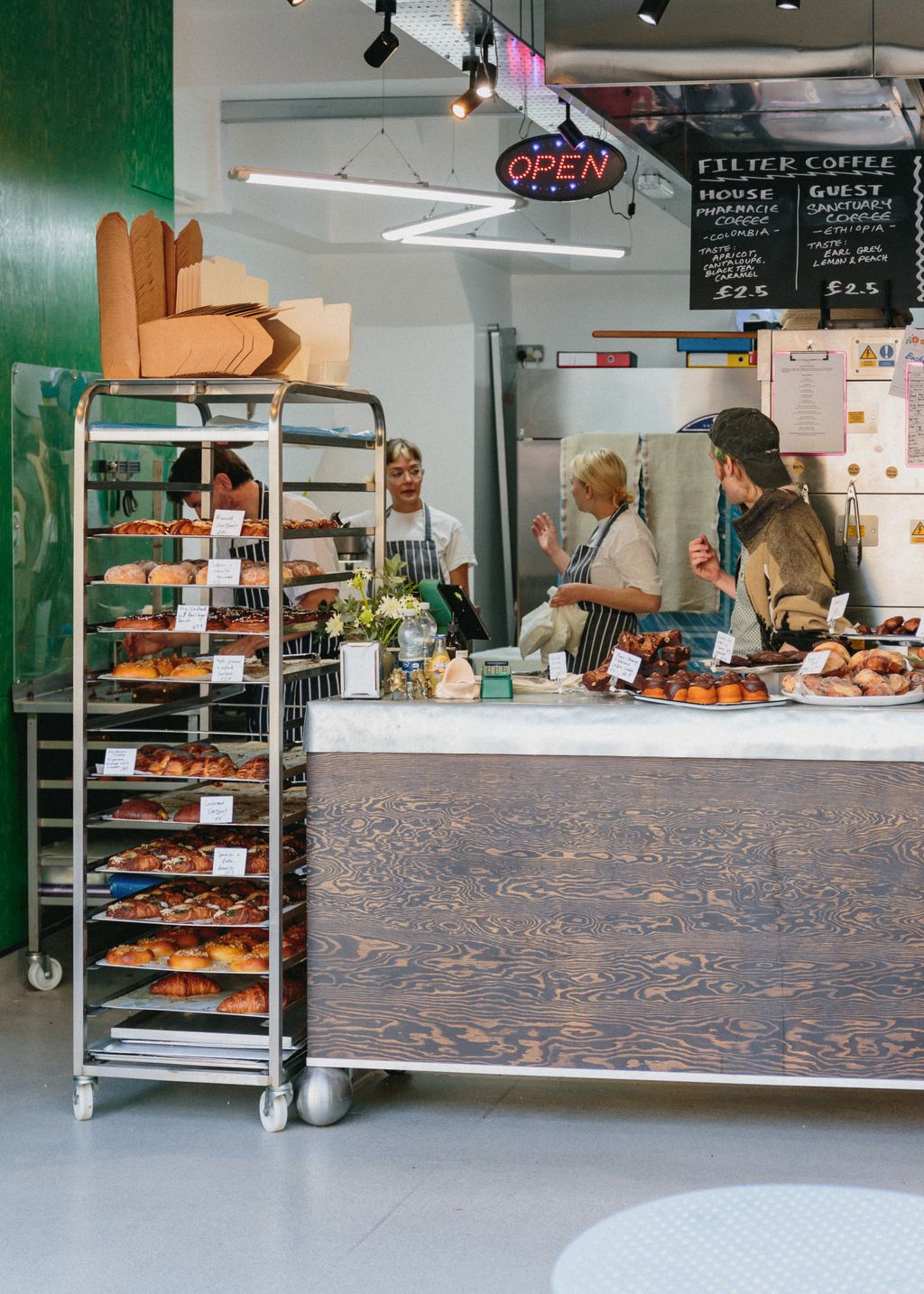 Shelves filled with various sweet buns and pastries at Toad Bakery in Peckham.