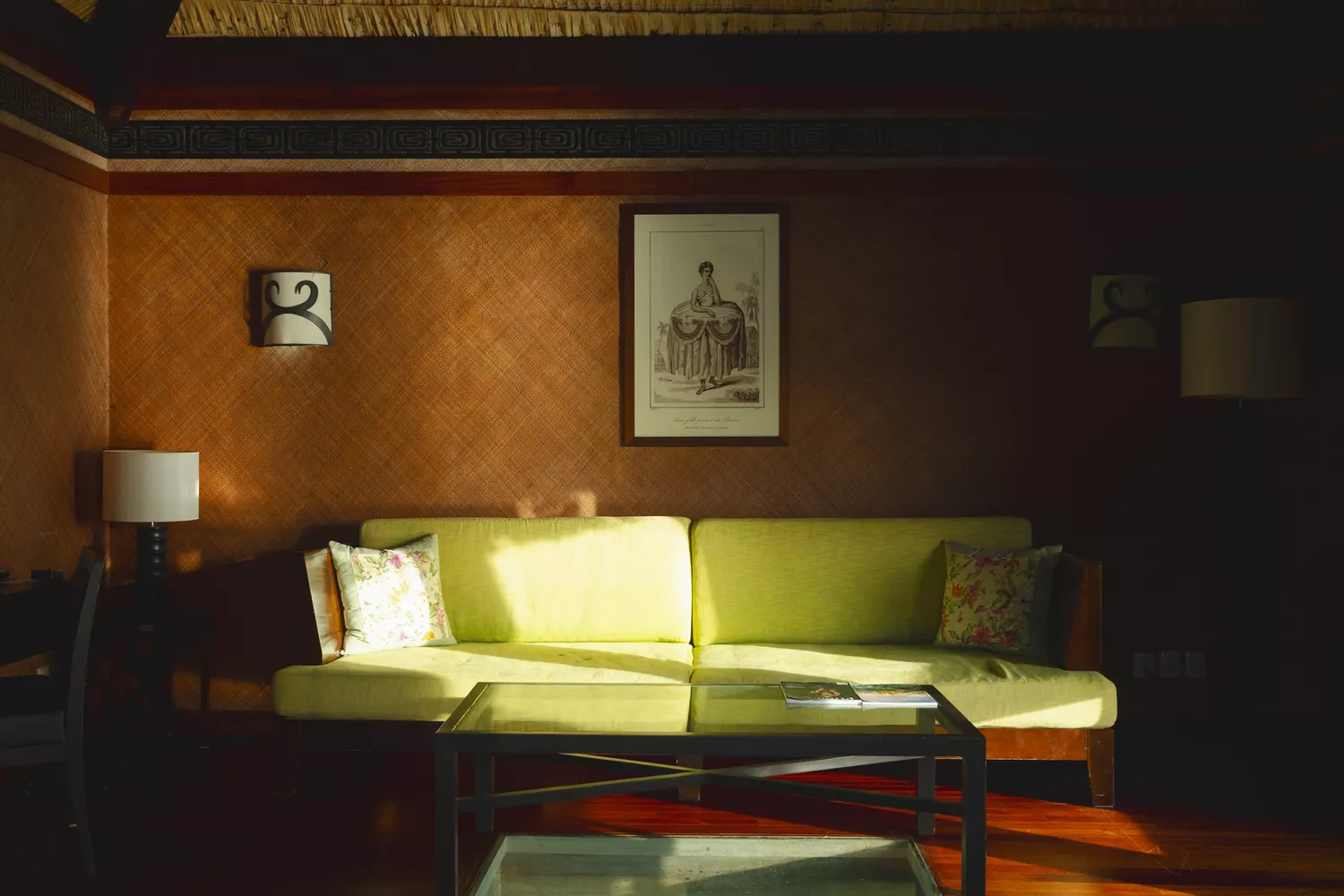 A luxurious and spacious seating area inside a hotel room in French Polynesia.