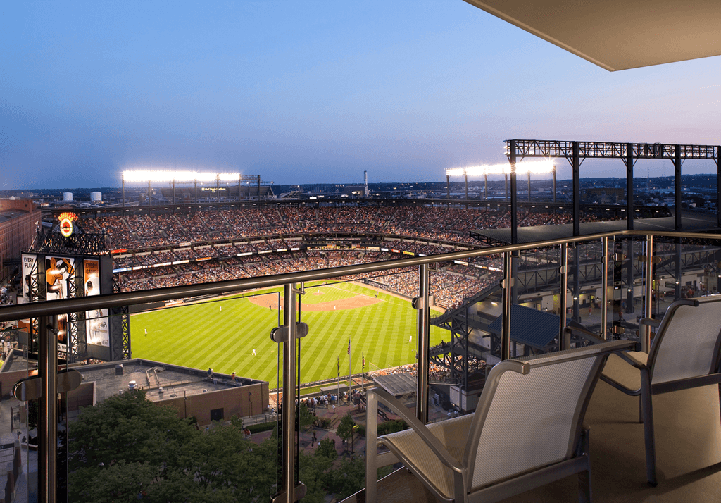 View from a hotel balcony looking down at the Oriole Park at Camden Yards baseball field.