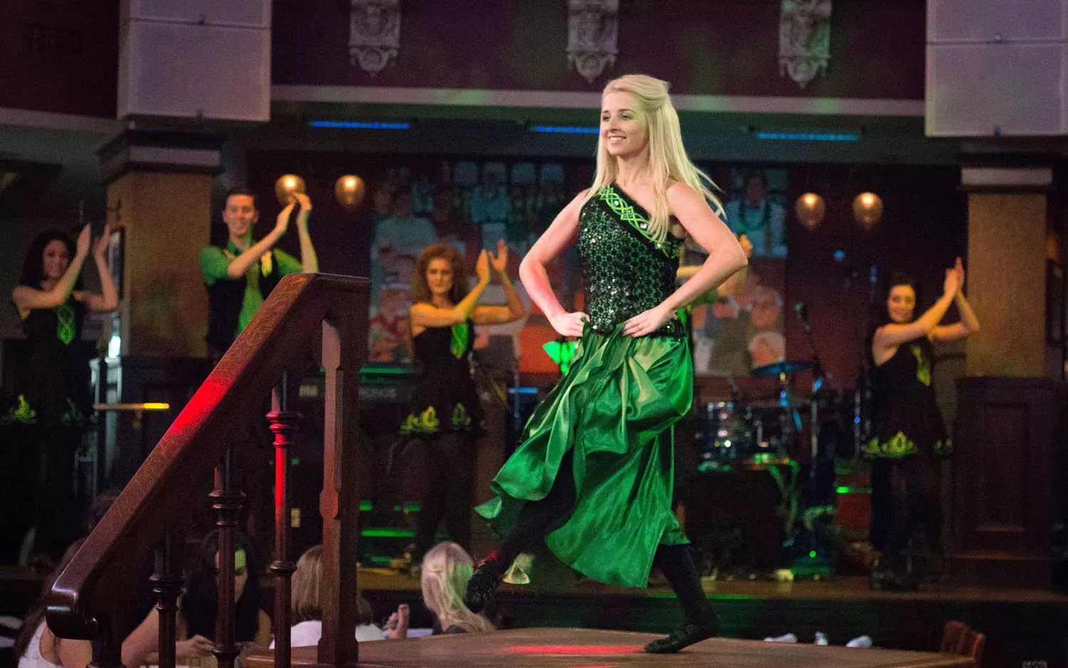 Irish dancers performing on an outdoor stage at Raglan Road in Disney Springs.