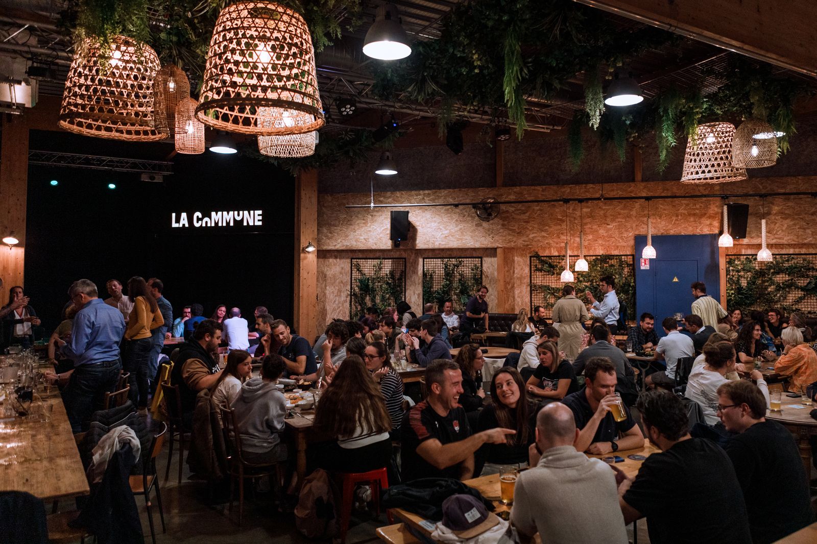 A modern, urban restaurant interior with contemporary lighting and a casual dining vibe.