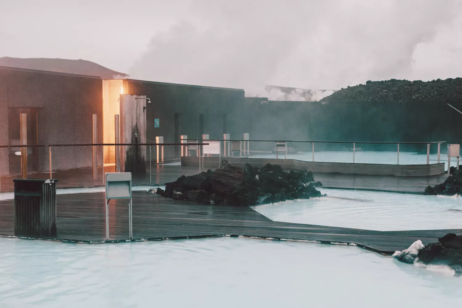 The milky blue waters and rising steam of the Blue Lagoon geothermal spa.