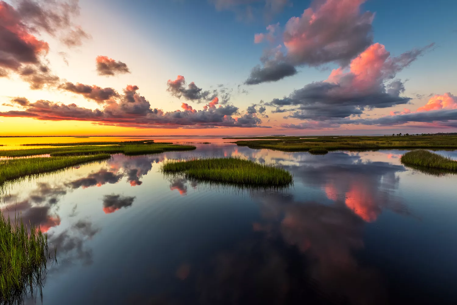 A tranquil sunset view overlooking the calm waters of St. Joseph Bay from the perspective of Salinas Park.