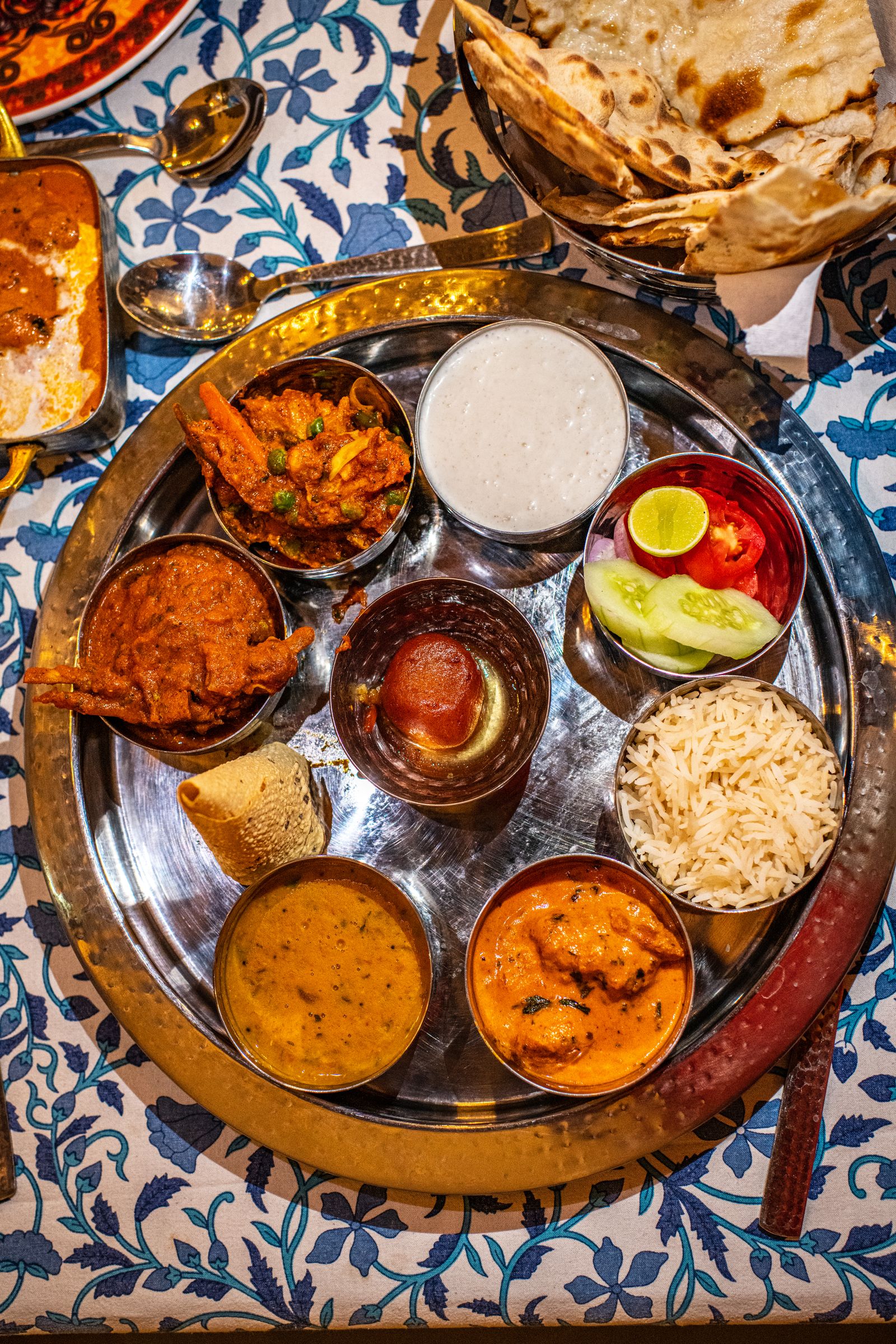 A well-presented spread of traditional Indian non-vegetarian dishes.