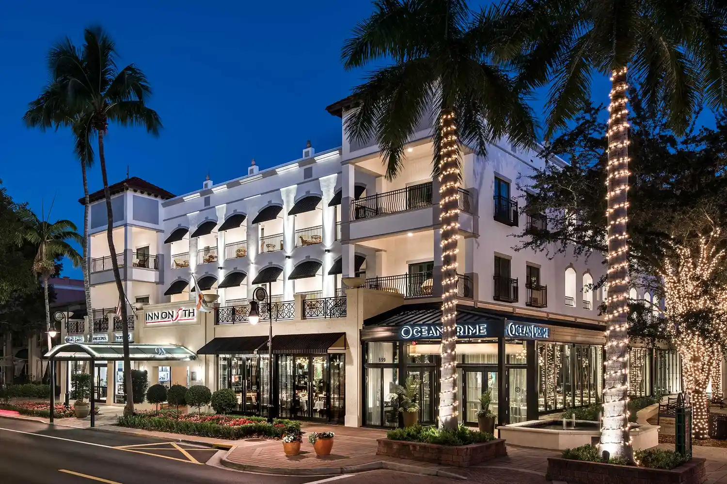 Exterior view of the historic Inn on Fifth Naples building with signature architecture