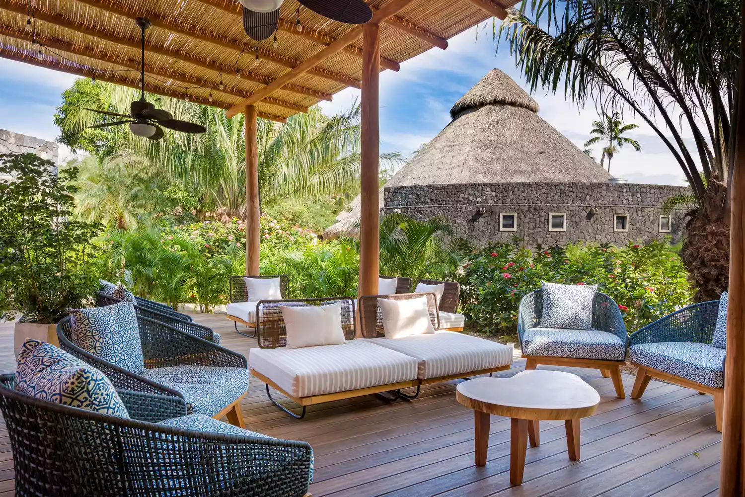 A peaceful wooden deck with lounge chairs overlooking the lush Costa Rican jungle at Westin Reserva Conchal.