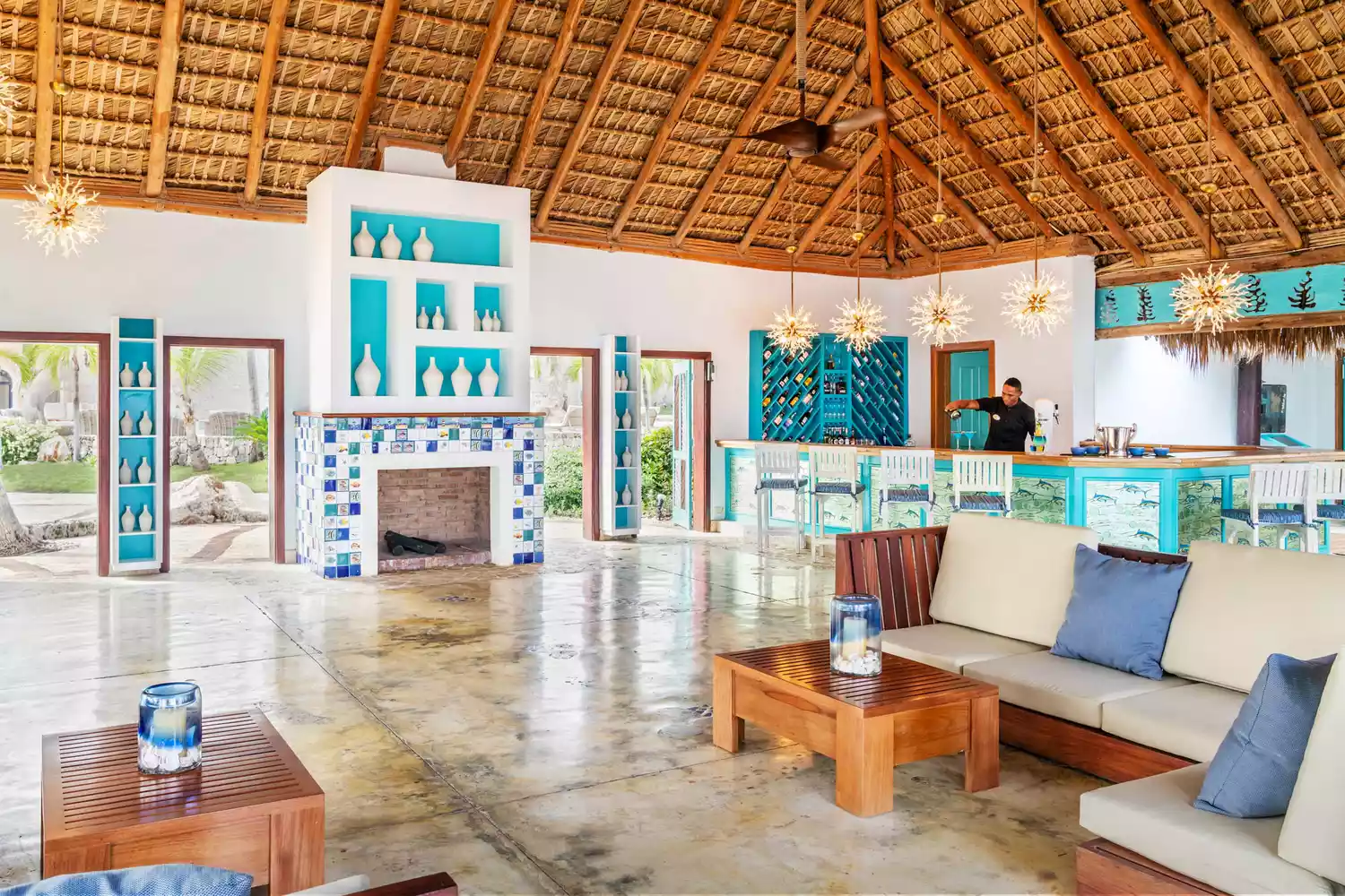 Interior view of the sophisticated white and blue lobby at Sanctuary Cap Cana.