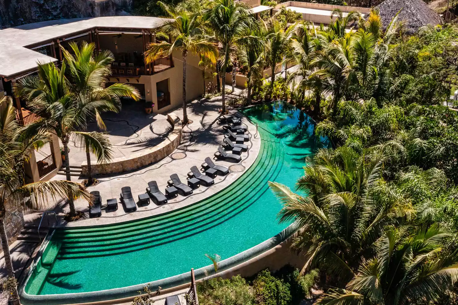 Aerial view of multiple tiered swimming pools at Delta Hotels by Marriott Riviera Nayarit.